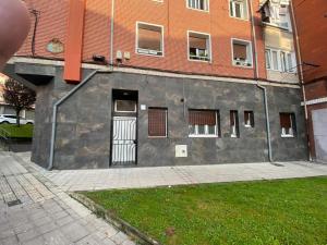 a building with a door on the side of it at Hospital Cruces Metro Bec in Barakaldo