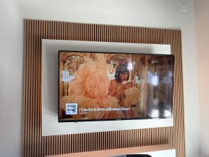 a picture frame with a picture of a woman in a costume at The Dim Light - One Bedroom in Paducah