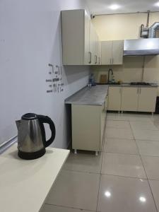 a kitchen with a tea kettle sitting on a counter at Caspian in Baku