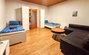 a living room with two beds and a couch at Worker's Apartment in Bergisch Gladbach in Bergisch Gladbach