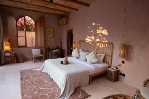 a bedroom with a bed with a teddy bear on it at Villa Pinkaboo - Gorgeous and Luxury One-Bedroom Villa in the Heart of Canggu in Canggu +85 photos