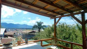 a view of the city from the balcony of a house at Maia House Hostal in Florianópolis