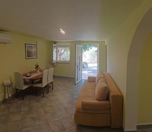 a living room with a couch and a table at Robinson's house in Kruševo