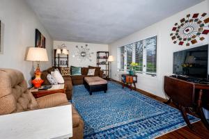 a living room with a couch and a table at Three Bedroom Cabin in Nashville