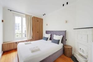 En eller flere senge i et værelse på Beautiful apartment L031