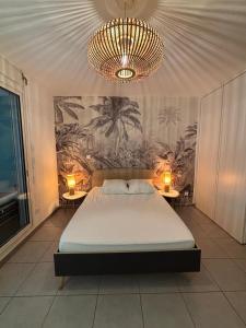 Postel nebo postele na pokoji v ubytování Le Corail - plages - parking - clim - wifi + 2 fotografie