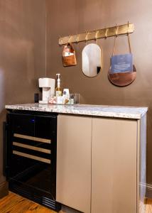 a kitchen with a counter with a counter top at Hollyhock Suite 512 in Louisville