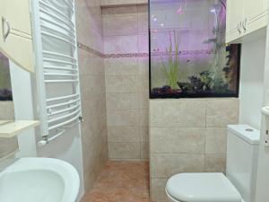 Koupelna v ubytování NeNa Apartmani - Ruma + 6 fotografií