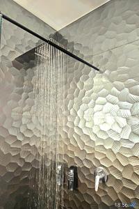 a bathroom with a shower with a bunch of chandeliers at URBAN LOFT VALENCIA in Valencia +62 photos