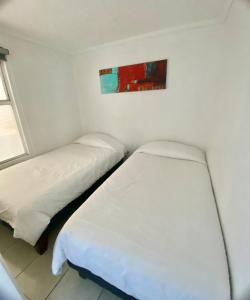 Ένα ή περισσότερα κρεβάτια σε δωμάτιο στο Departamento Playa Cochoa, Reñaca