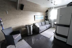 a living room with a couch and a table at Luxury Apartment in the Heart of Pello in Pello