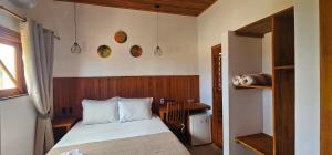 a small bedroom with a bed and a desk at Upwind Villas Boutique - Praia de Maceió - Camocim - CE in Maceio +68 photos