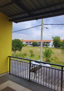 a balcony with a view of a field at 12pax Senai RestHome near Senai Airport in Kampung Seelung +44 photos