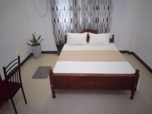 Postel nebo postele na pokoji v ubytování S & S Home Stay