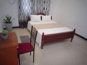 Ένα ή περισσότερα κρεβάτια σε δωμάτιο στο S & S Home Stay