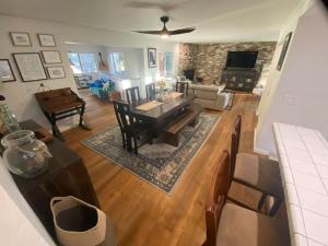 a large living room with a table and a couch at Sunny Lakeview Retreat - Private Beach Access in Skyland