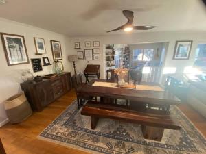 a living room with a dining room table and a rug at Sunny Lakeview Retreat - Private Beach Access in Skyland +7 photos