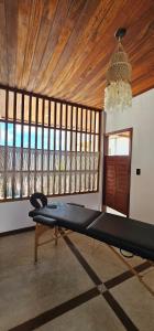 a gym with a bench in a room with a ceiling at Upwind Villas Boutique - Praia de Maceió - Camocim - CE in Maceio