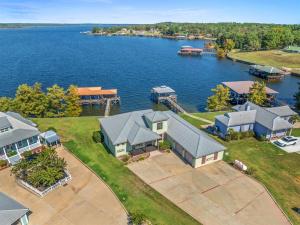 an aerial view of homes on the water at Lake Escape Paradise Premier fishing getaway in Zwolle