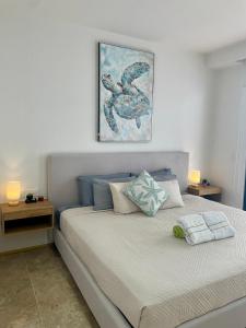 Ένα ή περισσότερα κρεβάτια σε δωμάτιο στο Estudio moderno con alberca - Centro