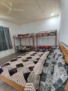 Ένα ή περισσότερα κρεβάτια σε δωμάτιο στο TTS Homestay