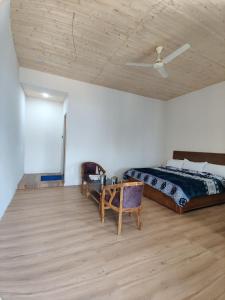 Ένα ή περισσότερα κρεβάτια σε δωμάτιο στο TTS Homestay