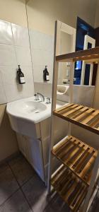 a bathroom with a sink and a mirror at Casa Pier Giorgio Bella Vista in El Chalten