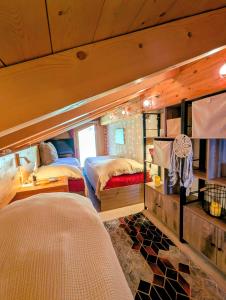 a bedroom with two beds in a room at Chalet Talisman auf der Riederalp in Riederalp