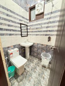 a bathroom with a toilet and a sink at Mehtab guest house in Jalandhar