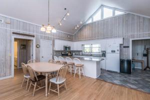 a kitchen and dining room with a table and chairs at Crowfield in Edisto Beach