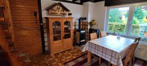 a dining room with a table and a window at Ferienwohnung Gläser in Hilchenbach