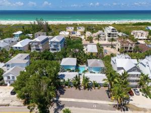 an aerial view of a resort with the beach at Book Me Baby! Wildflower Inn Siesta Key #3 Orchid in Siesta Key