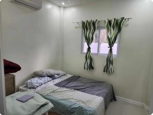 Giường trong phòng chung tại JMC6 Villa Bolod Panglao Bohol - Sweet Caroline Travel Hub