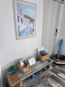 a room with a bench with baskets on it at Ocean Attic Tufia in Telde +13 photos