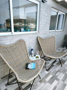 two chairs and a table on a patio at Ocean Attic Tufia in Telde
