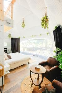 a living room with a bed and a coffee table at Dôme du haut bearn in Monein