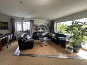 a living room with couches and a table at Ferienwohnung Dammer in Niederkrüchten +23 photos