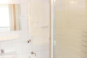 a bathroom with a shower and a sink at Hotel Art-Ambiente in Hagen +22 photos