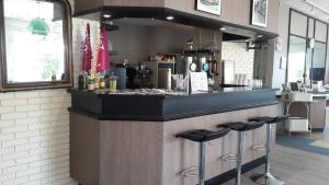 Lounge nebo bar v ubytování Contact Hôtel ALYS Bourg en Bresse Ekinox Parc Expo