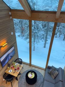an overhead view of the living room of a tree house at Villa Auroras Pöllö in Syöte
