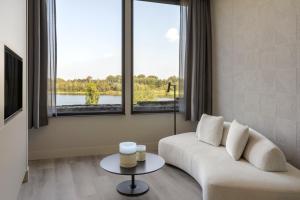 Khu vực ghế ngồi tại De Bronsbergen Boutique Wellness & Hotel