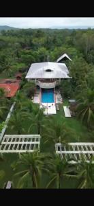 an aerial view of a building with a pool at Kudos Boutique Hotel in Cabrera