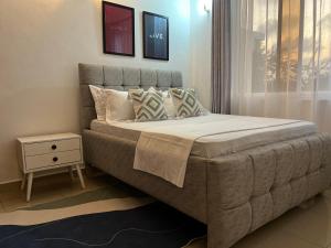 Postel nebo postele na pokoji v ubytování Sand City, Nightingale Apartments Shanzu + 29 fotografií