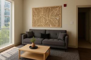 a living room with a couch and a table at Central Birmingham Stylish Midrise Unit in Birmingham +20 photos