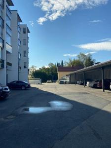 a puddle of water on the ground in a parking lot at Modern Apartment for 2 with Sauna in Kemi