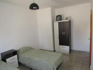 Ένα ή περισσότερα κρεβάτια σε δωμάτιο στο Departamento Achalay