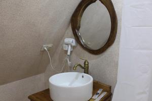 a bathroom with a white sink and a mirror at Tun Arevin in Vaykʼ +46 photos
