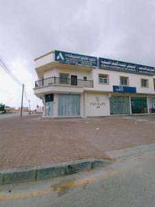 a building on the side of a street at هومي 2 in Salalah