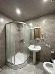 a bathroom with a shower and a sink at Apartment N111 Loft 2 in Gudauri