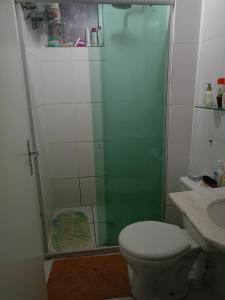 a bathroom with a shower with a toilet and a sink at AP COP 30 com Garagem em Cond in Marituba